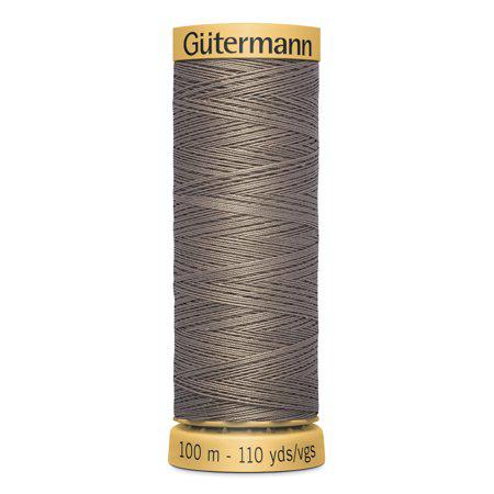 Spool of Gutermann thread on a white background