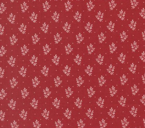 Red fabric with small white floral pattern
