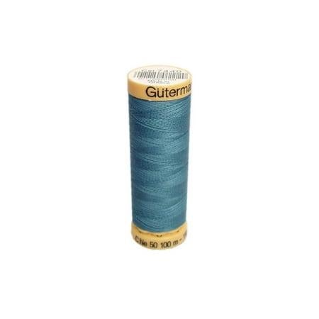 Spool of Gutermann thread on a white background