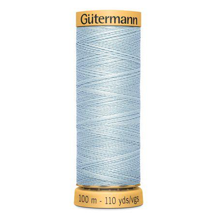 Spool of Gutermann thread on a white background