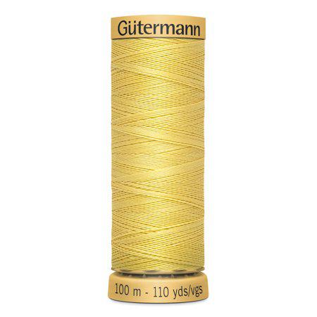 Spool of Gutermann thread on a white background
