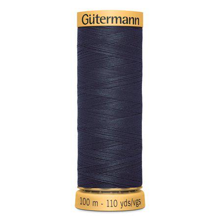 Spool of Gutermann thread on a white background