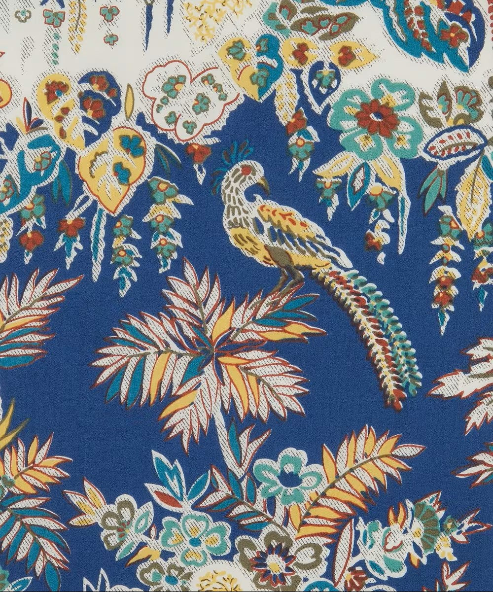 Colorful floral and bird pattern on a blue background