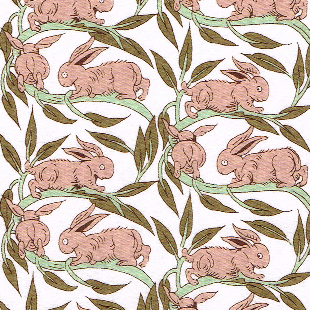 Pattern of pink rabbits on green leaves with a white background