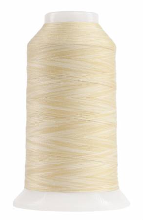 Spool of beige thread on a white background