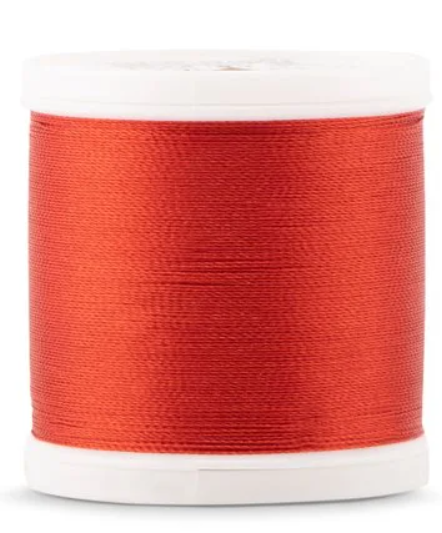 Spool of Madeira Polyneon 40wt machine embroidery thread in Rust, color 1821
