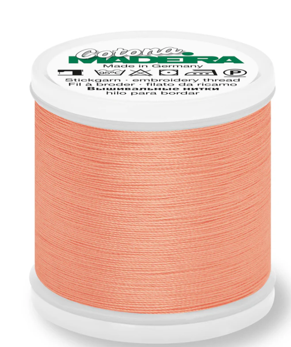 Spool of Madeira Cotona 30wt 100% cotton thread in Salmon, color 588