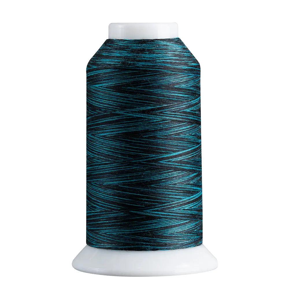 Spool of blue thread on a white background
