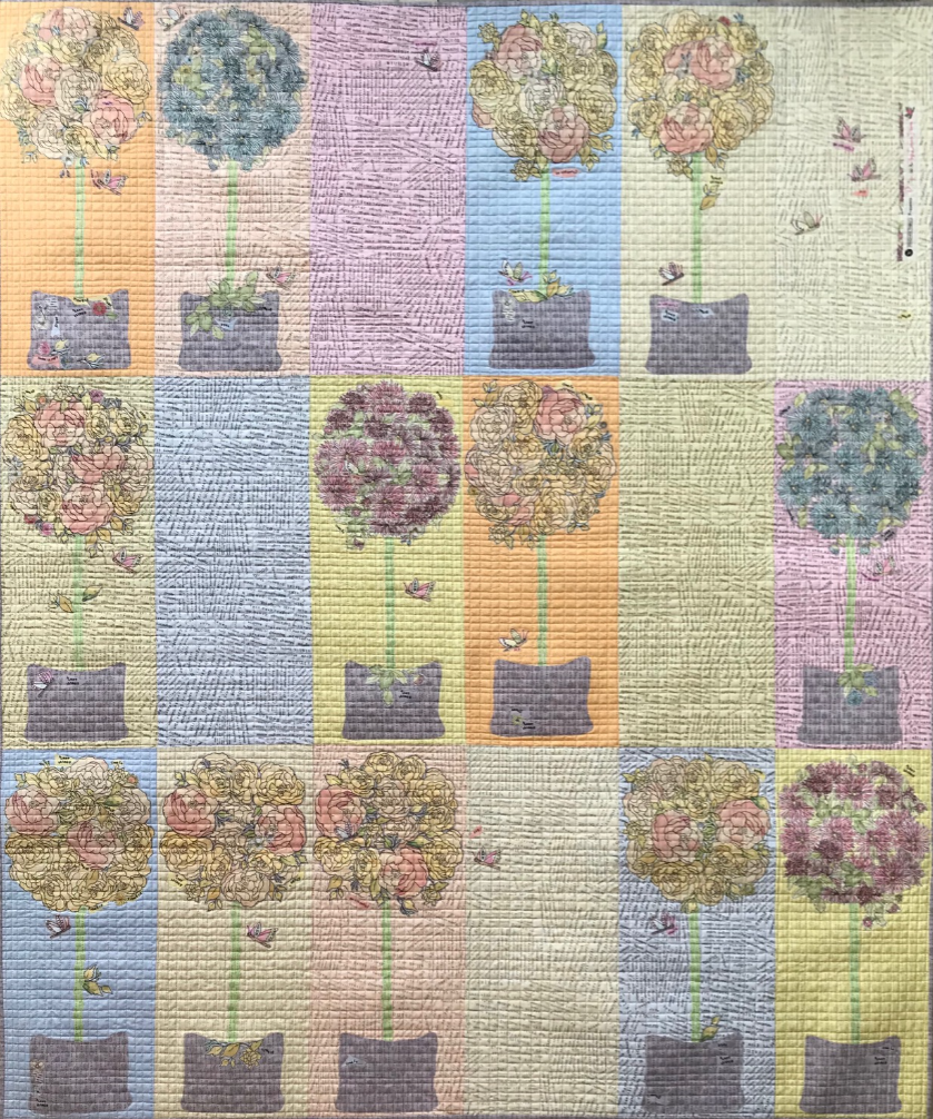 Topiary collage quilt pattern by Laura Heine featuring vibrant Potpourri fabric design and optional wall hanging pattern