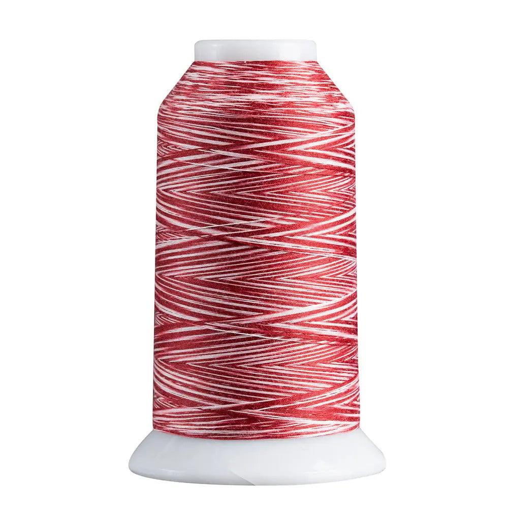 Spool of red and white thread on a white background