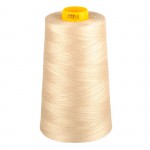 Spool of beige thread with a yellow end on a white background