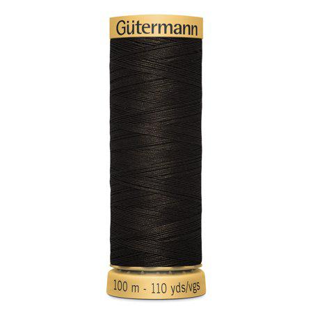 Spool of Gutermann thread on a white background