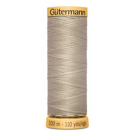 Spool of Gutermann thread on a white background