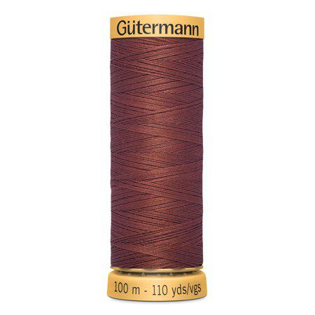 Spool of Gutermann thread on a white background