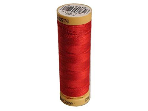 Red spool of thread with a label on a white background