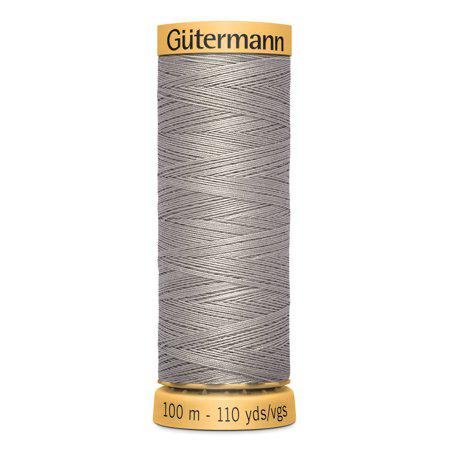Spool of Gutermann thread on a white background