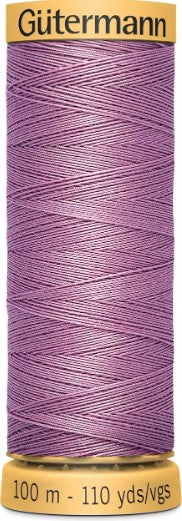 Spool of Gutermann thread on a white background