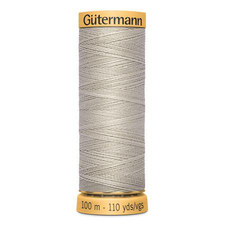 Spool of Gutermann thread on a white background