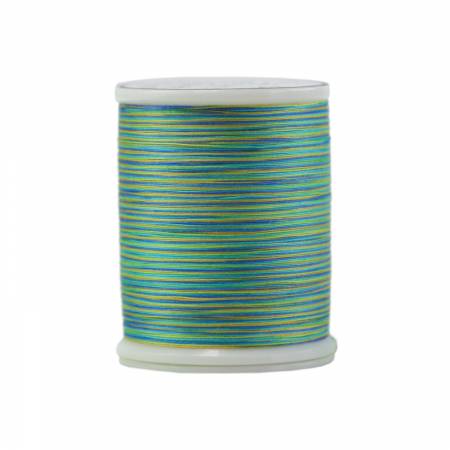 Spool of blue and green thread on a white background