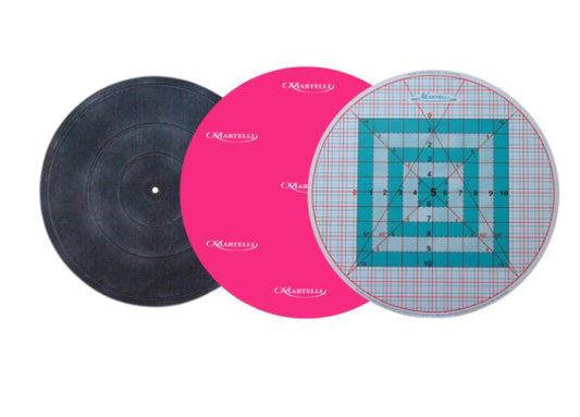 Vinyl record, pink vinyl record with grid design, and round ruler on a white background
