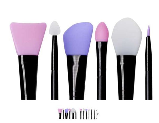 Set of makeup brushes with colorful bristles on a white background