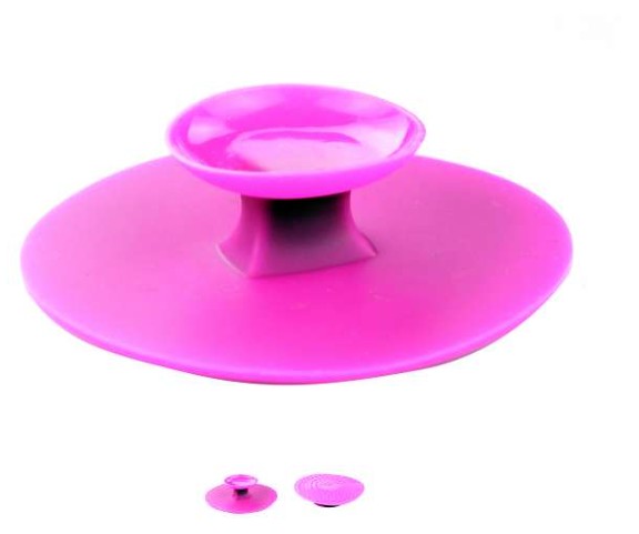 Pink suction cup with smaller versions on a white background