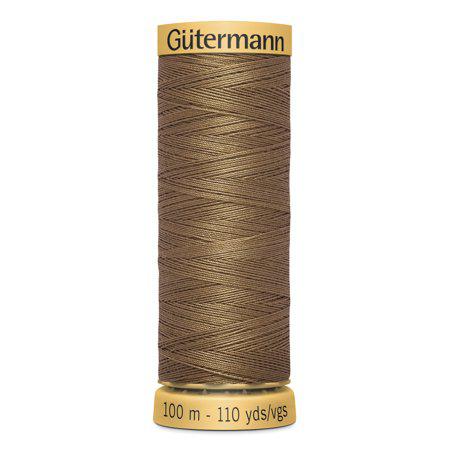 Spool of Gutermann thread on a white background