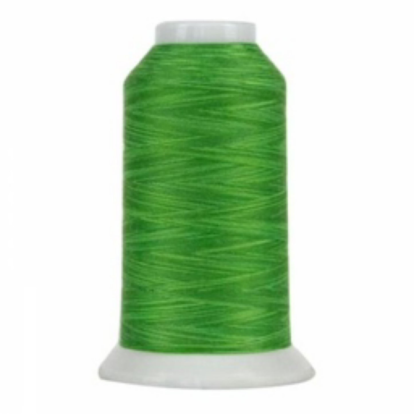 Spool of green thread on a white background