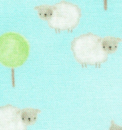 Sheep and tree pattern on a blue background