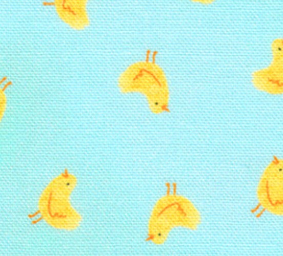 Pattern of yellow ducks on a light blue fabric background