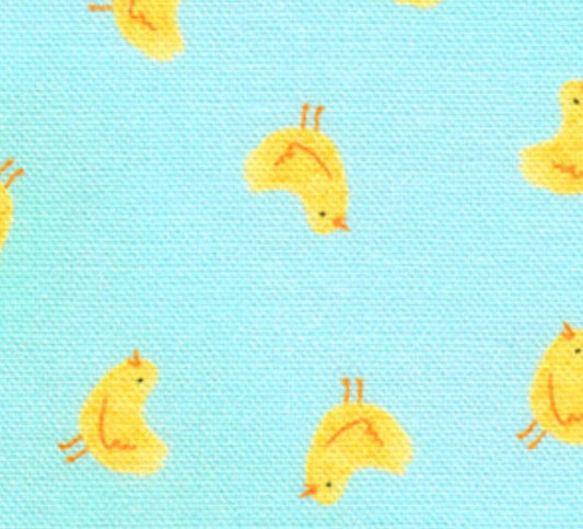 Pattern of yellow ducks on a light blue fabric background