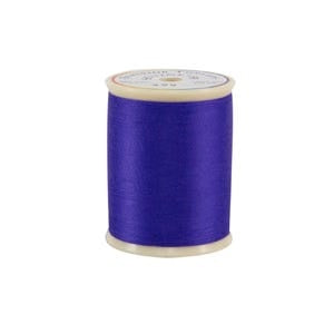 Spool of purple thread on a white background