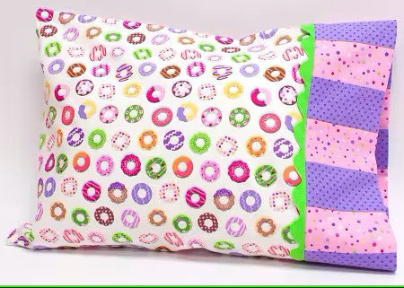 Colorful pillowcase with donut pattern on one side and solid color on the other