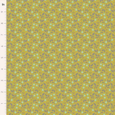 Fabric with a pattern of small green leaves on a yellow background