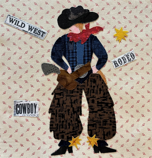 Fabric art of a cowboy with text labels on a patterned background