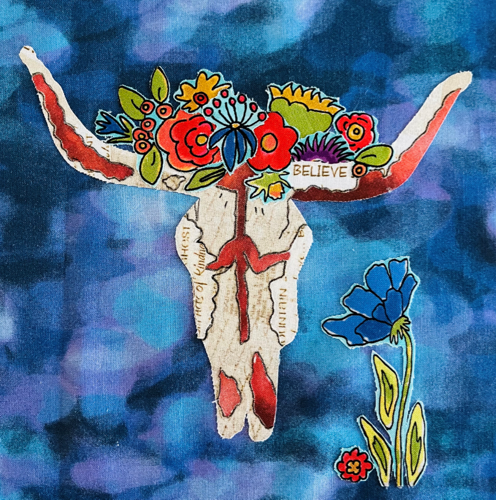 Decorative skull with floral crown and 'BELIEVE' text on a blue and purple abstract background