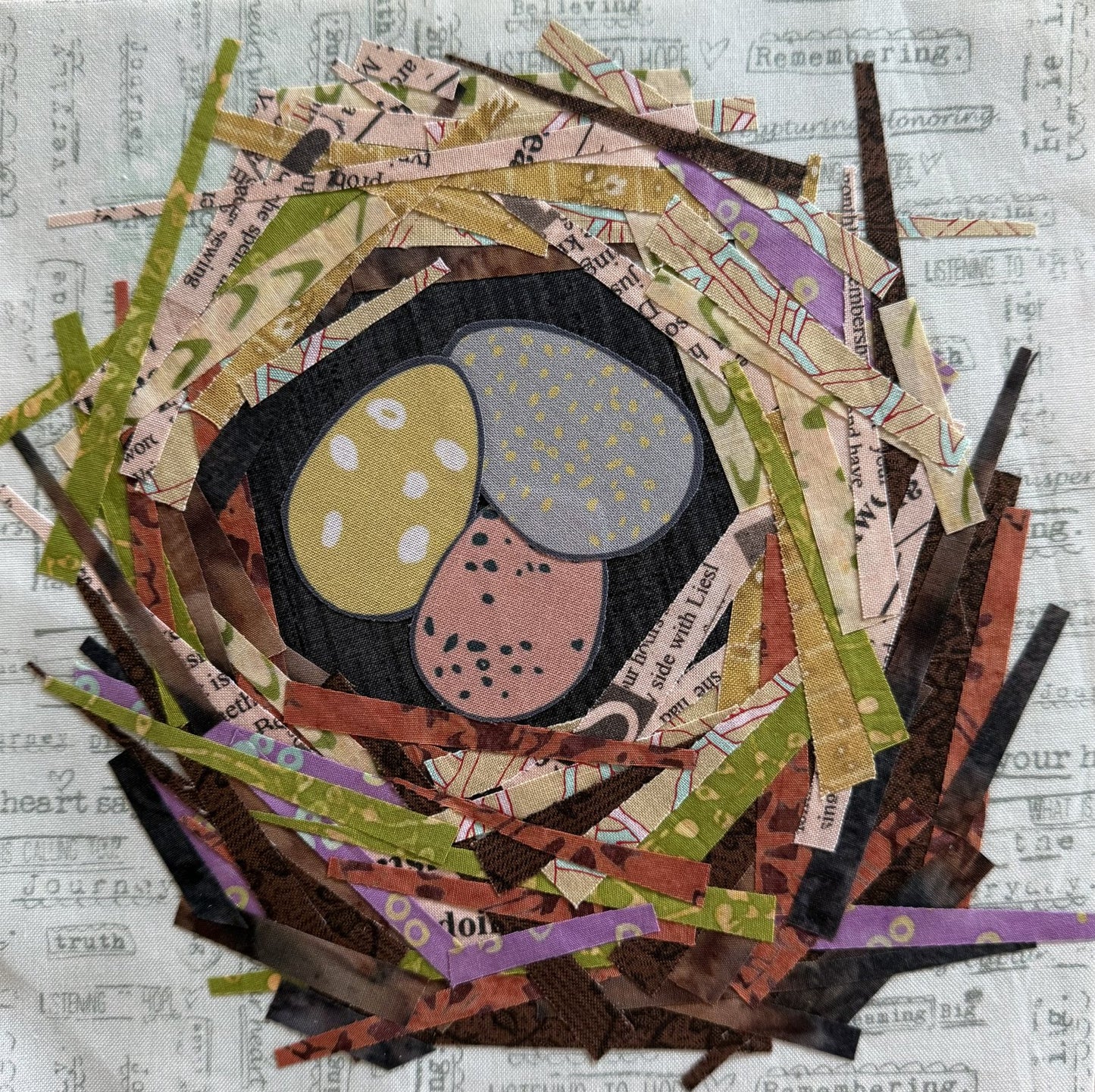 Artistic depiction of a nest with eggs made from cut paper on a textured background.