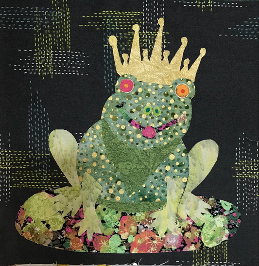 Decorative frog with a crown on a black background