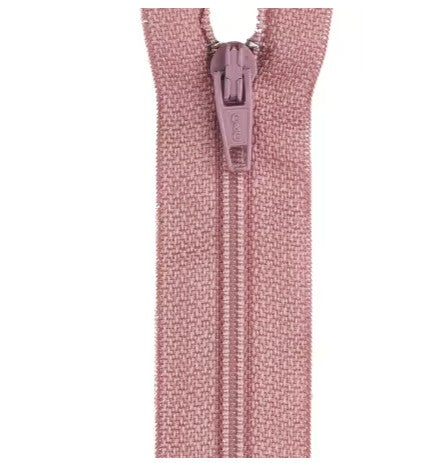 Pink zipper on a white background