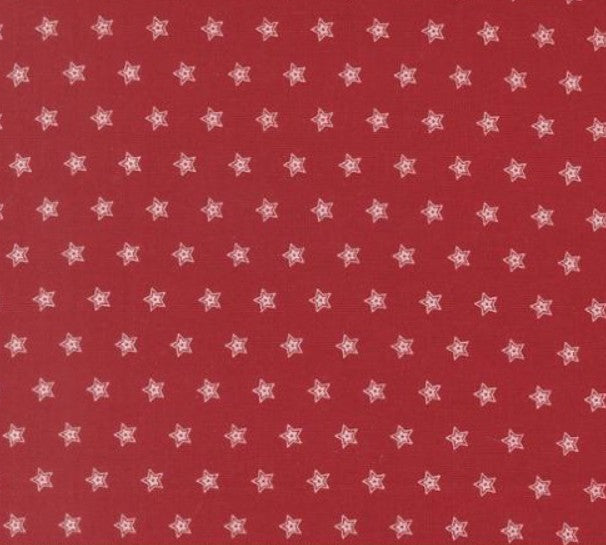Red fabric with small white star pattern