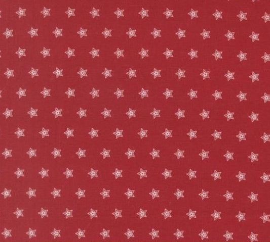 Red fabric with small white star pattern