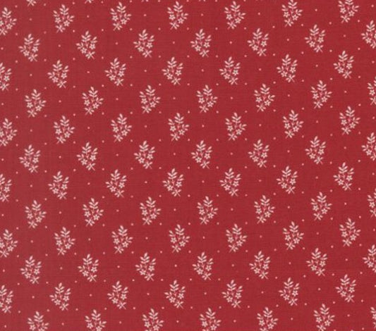 Red fabric with small white floral pattern