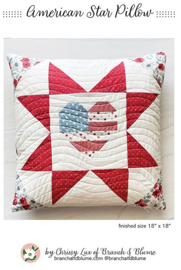 Quilted pillow with American star design on a white background