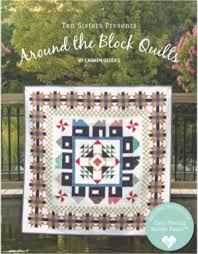 Quilt pattern book titled 'Around the Block Quilts' by Camille Roskelley with a quilt displayed on a green background.