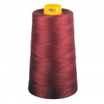 Spool of red thread with a yellow end on a white background
