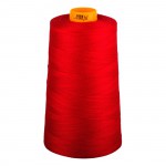 Red spool of thread with a yellow cap on a white background