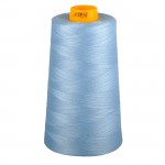 Spool of blue thread with an orange end on a white background