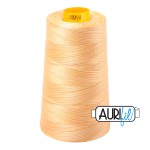 Spool of beige thread with a brand label on a white background