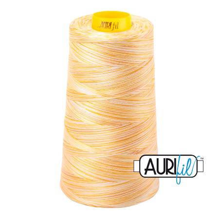Spool of Aurifil thread with a white background