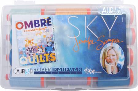 Packaging of Aurifil thread with Ombre and Sky designs, featuring a portrait of a woman.
